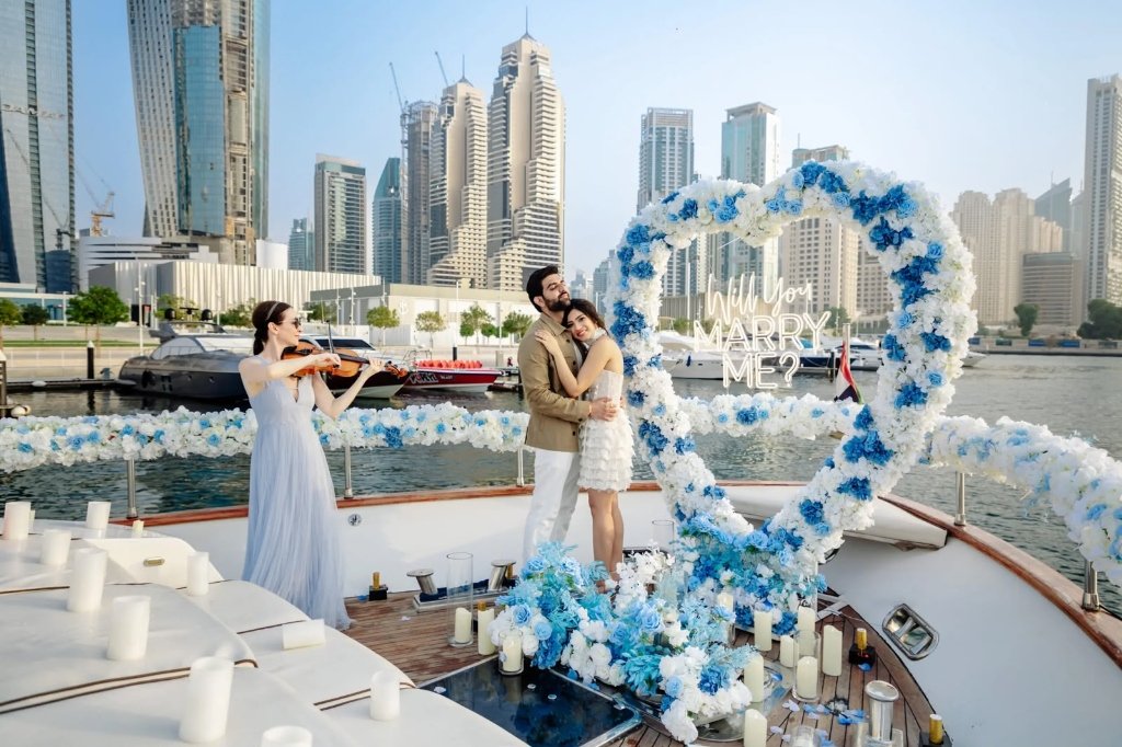 Romantic Marry Me Proposal Setup with Flower Arch & Violinist on Dubai Yacht