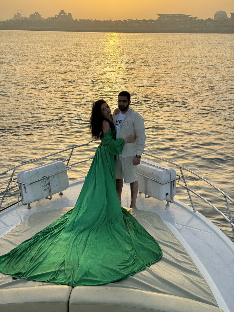 Couple champagne toast on yacht bow